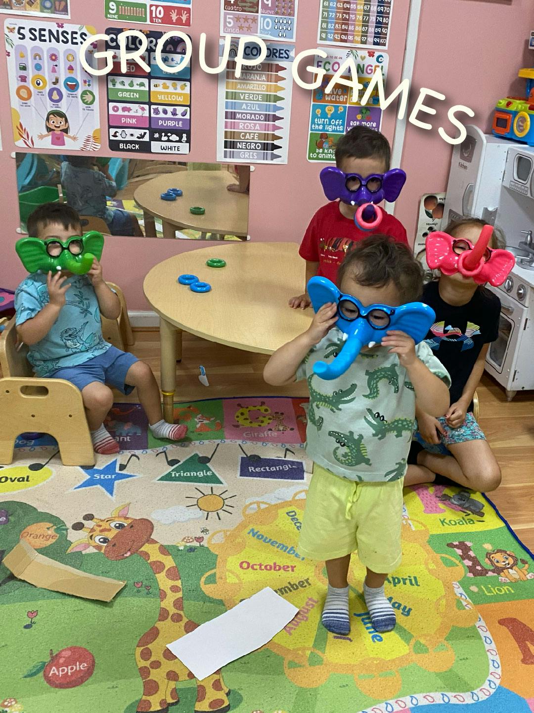 Children wearing elephant masks in a classroom