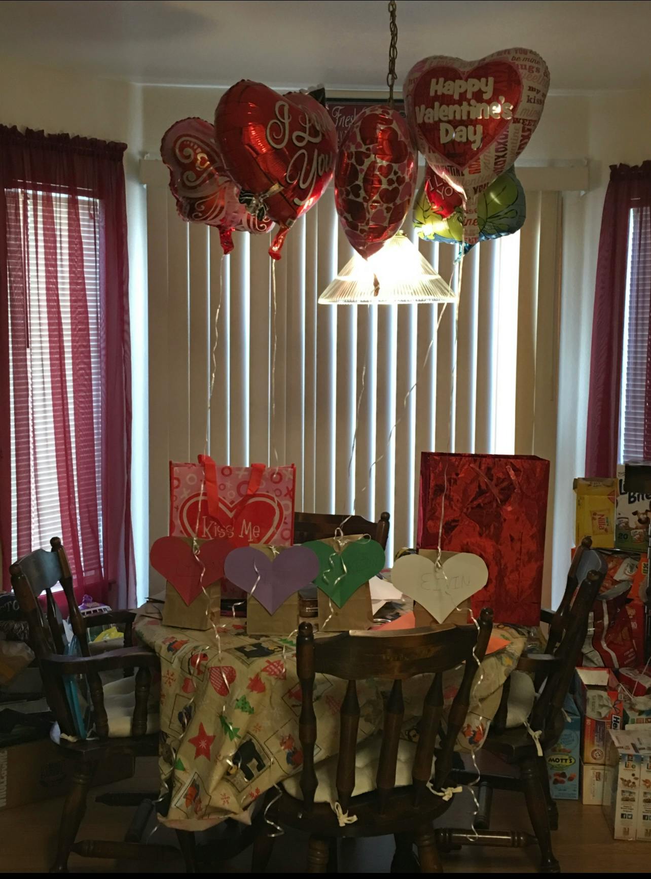 Heart-shaped balloons and decorations on a table