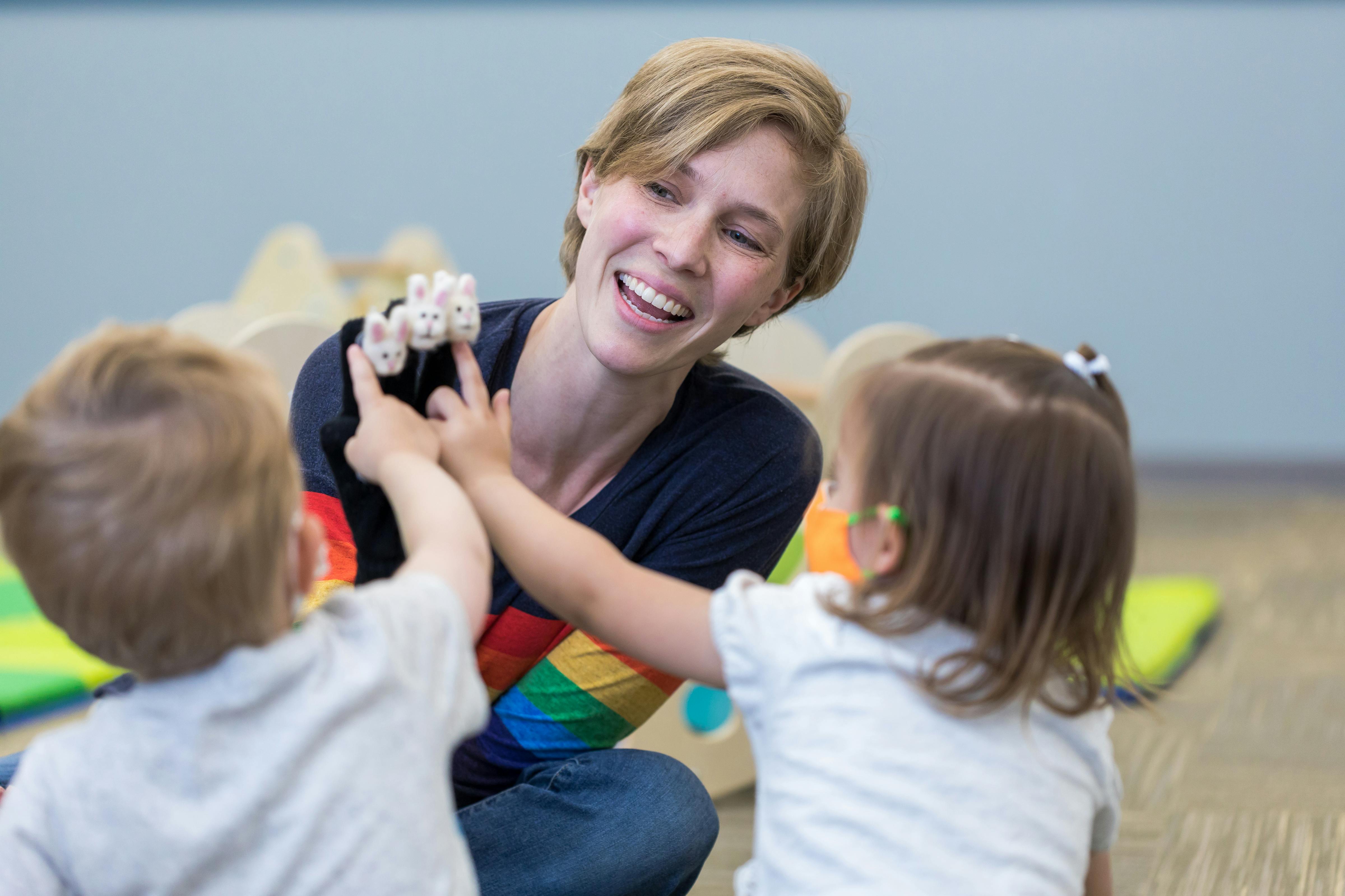 Person playing with two children
