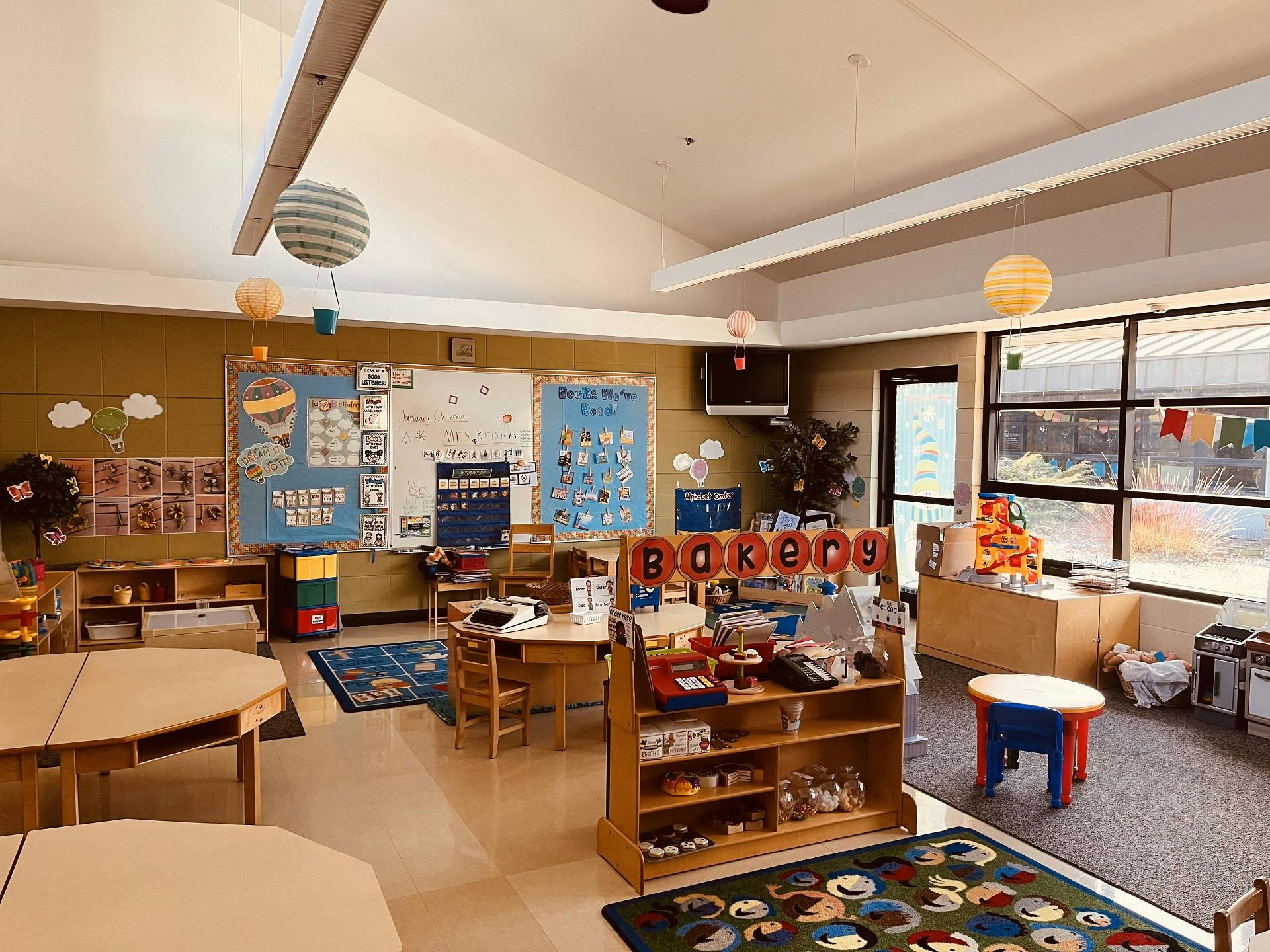 Classroom with tables, chairs, and learning materials