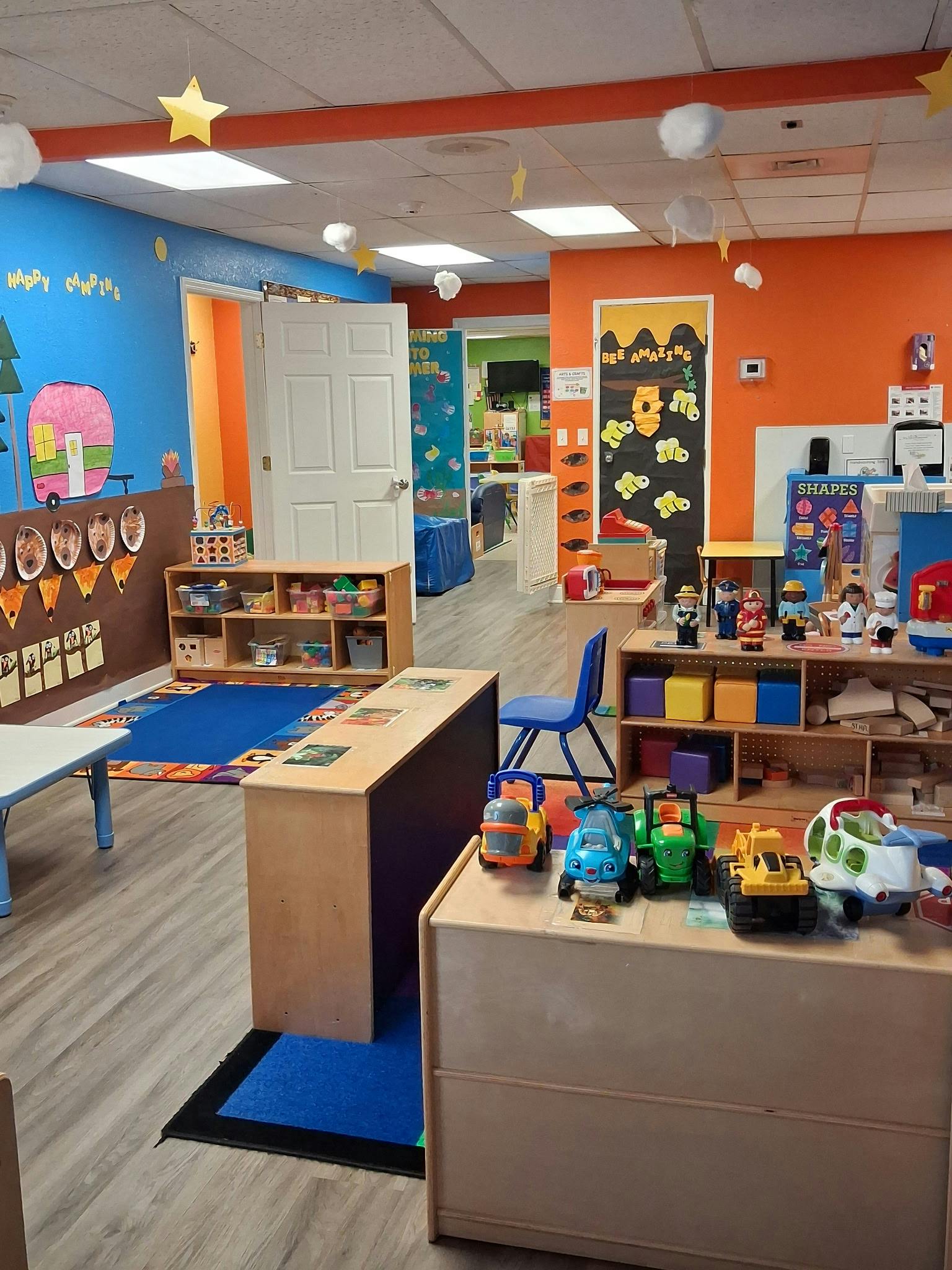 Colorful preschool classroom with toy vehicles and play areas