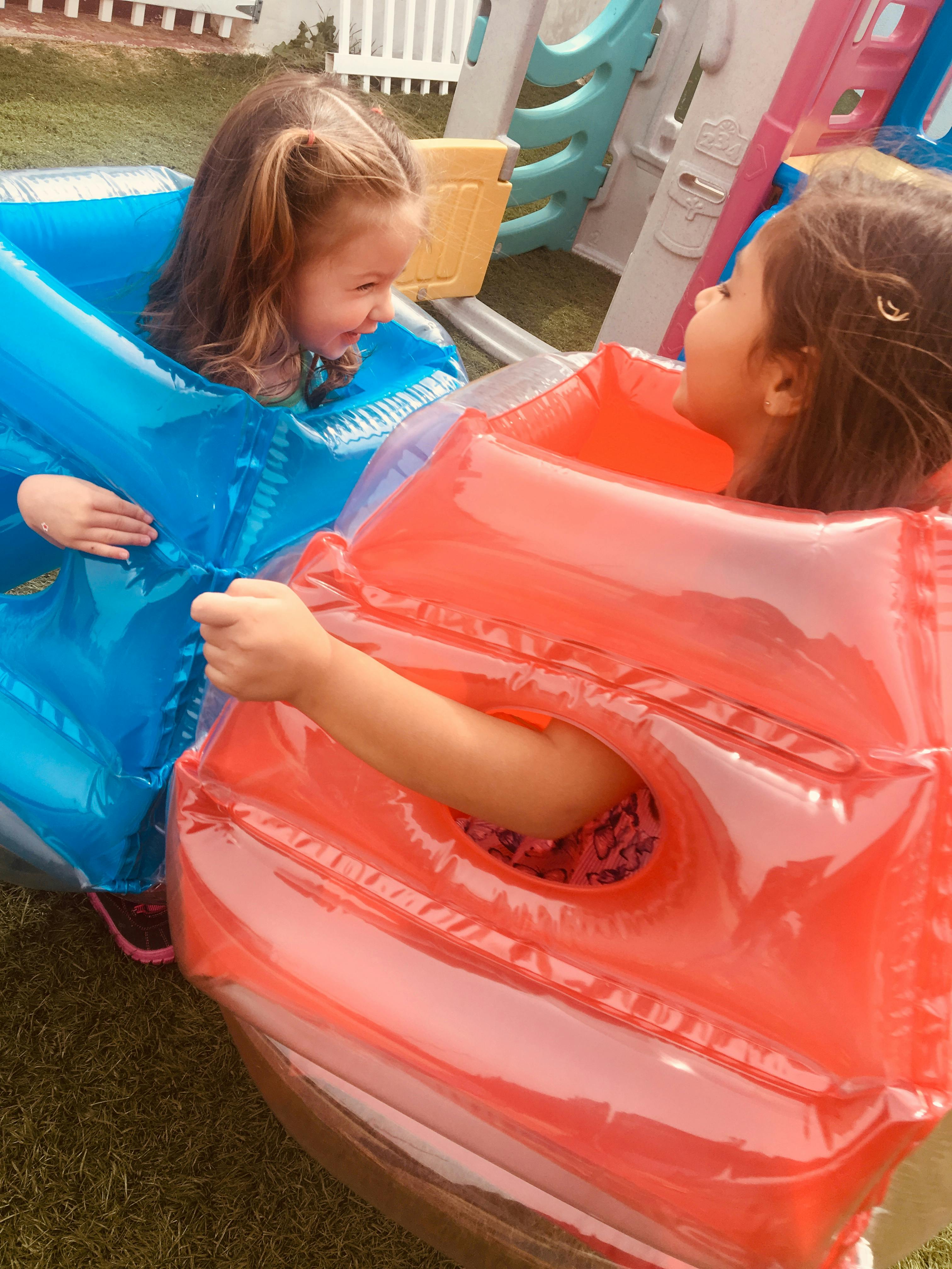 Two children in inflatable sumo suits