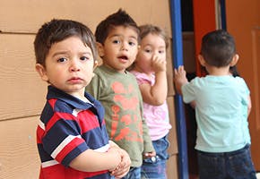 Four children standing together