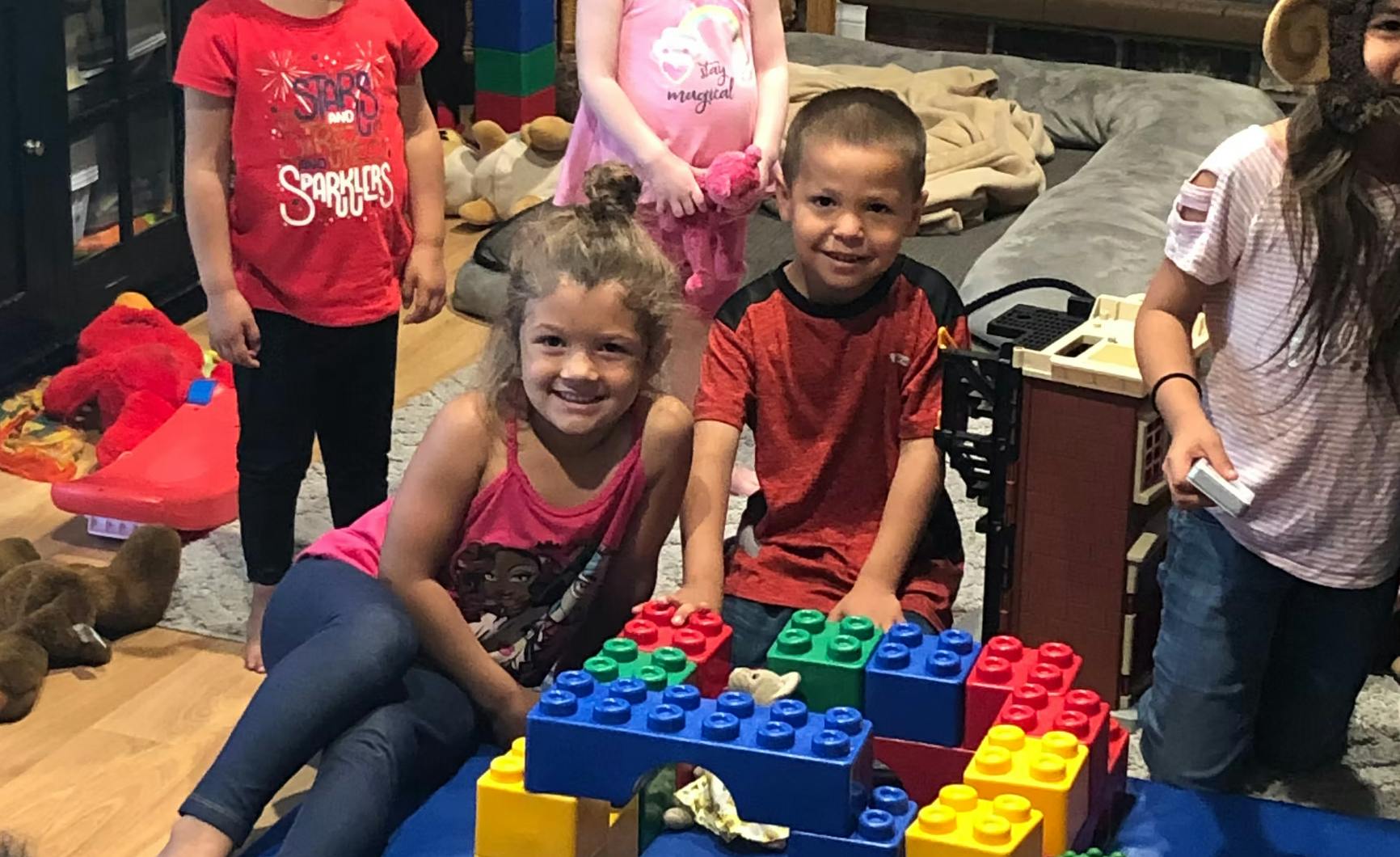 Children playing with large building blocks