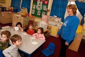Adult and children in a classroom