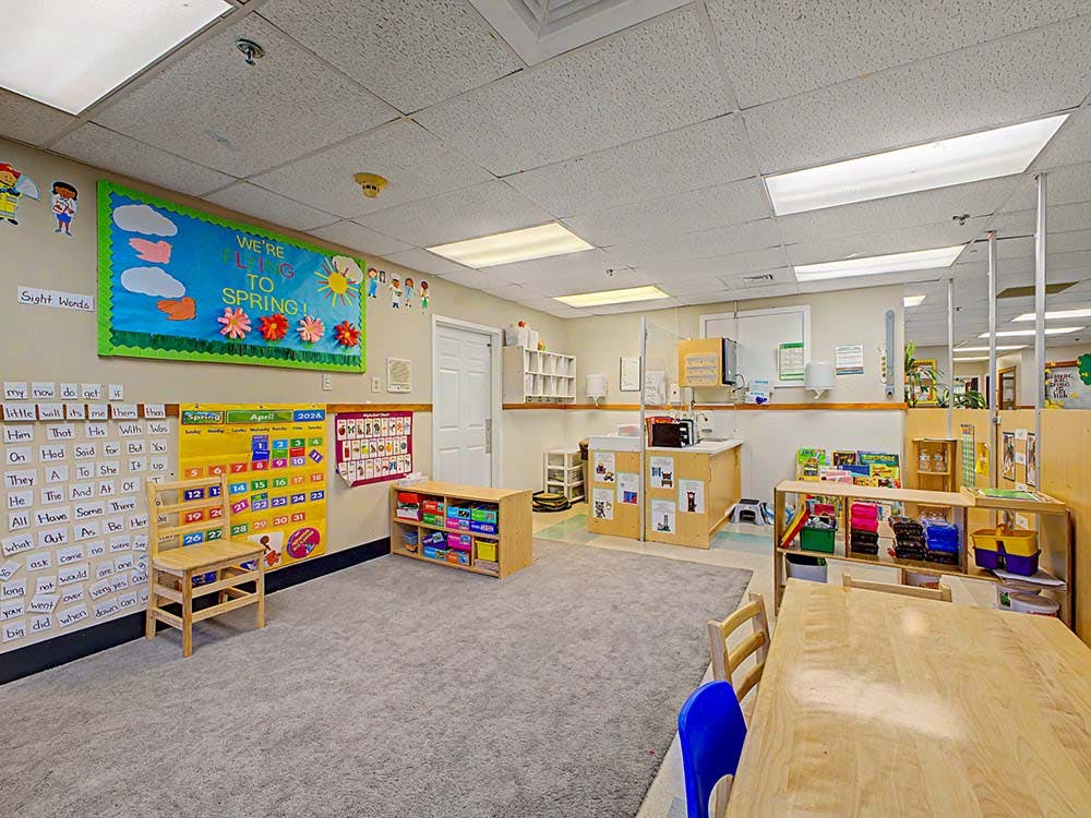 Classroom with spring decorations, a calendar, and children's furniture
