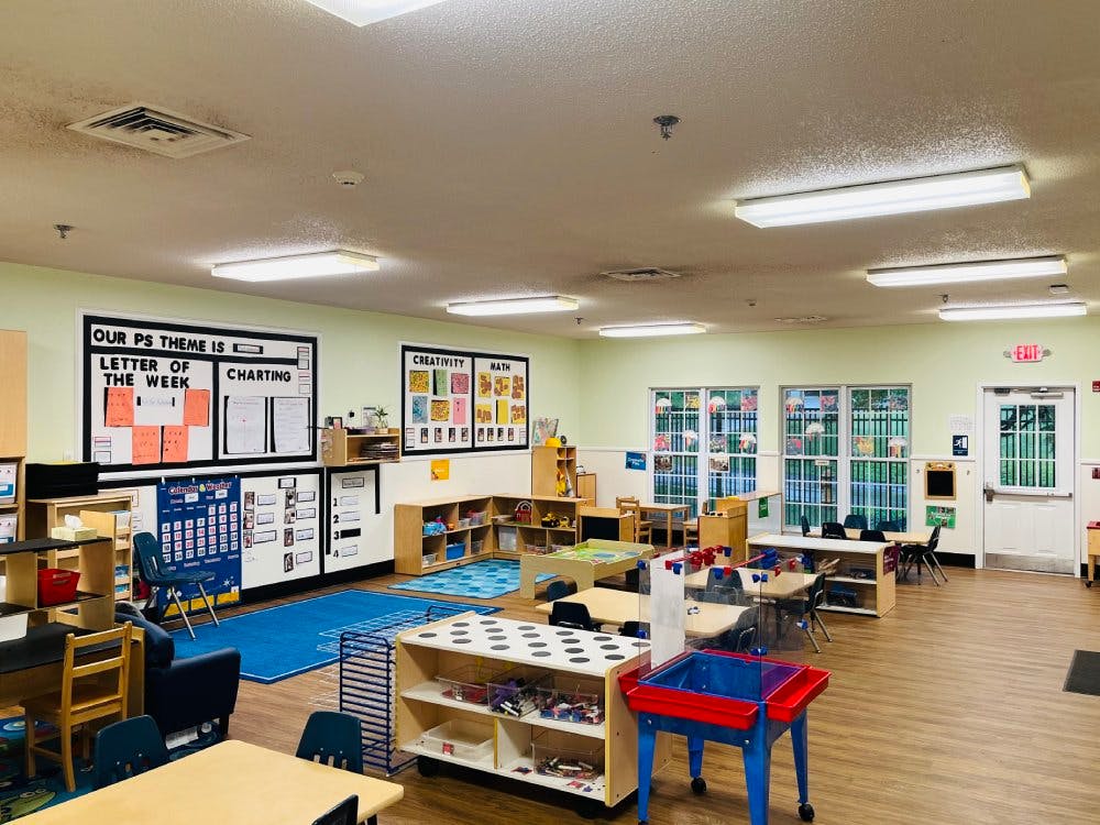 empty preschool classroom with activity stations