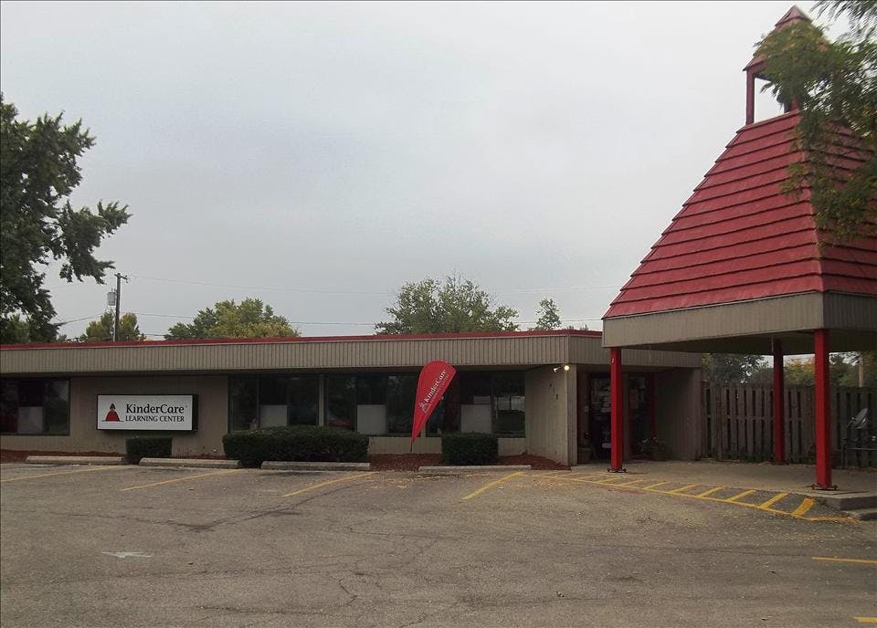 KinderCare Learning Center building and parking lot on an overcast day