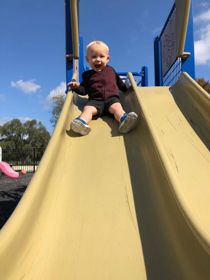 Child on a playground slide