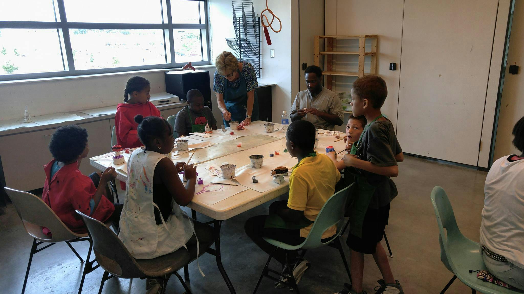 Adults and children gathered around a table