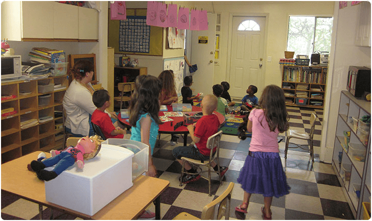 Adult and children in a classroom