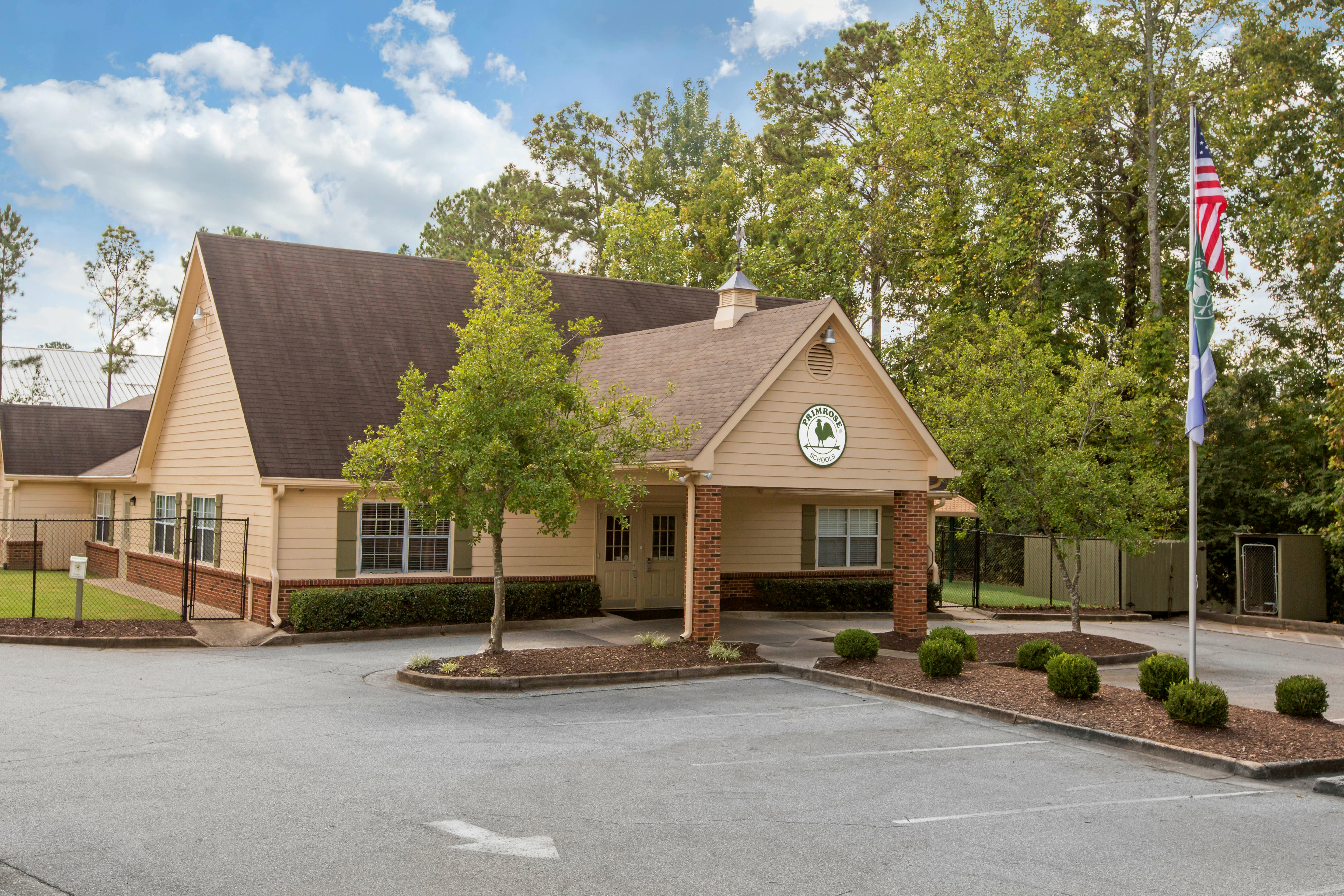 Primrose Schools building exterior with parking lot and trees