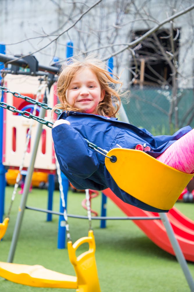 Child on a swing at a playground