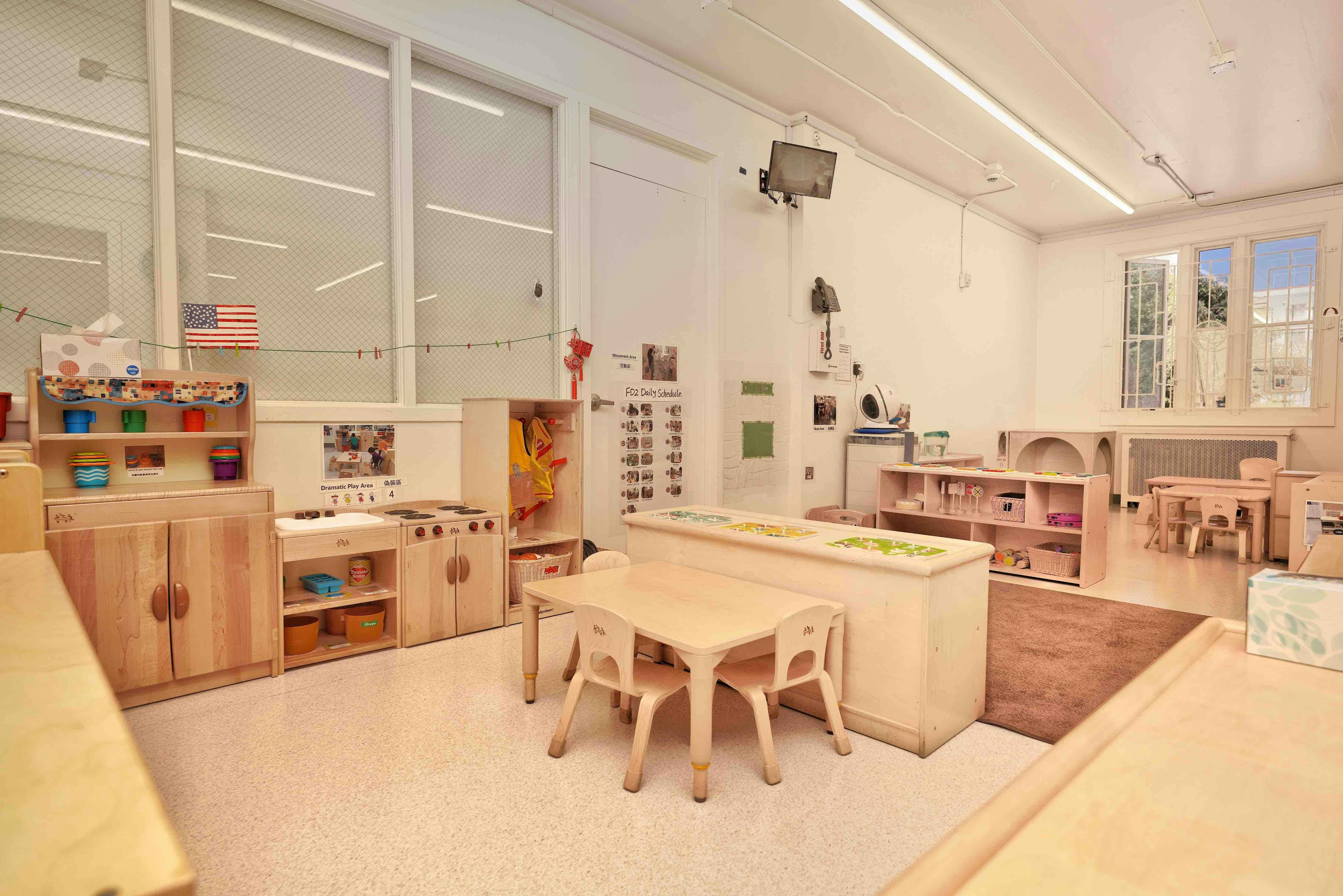 Classroom interior with children's furniture and learning stations