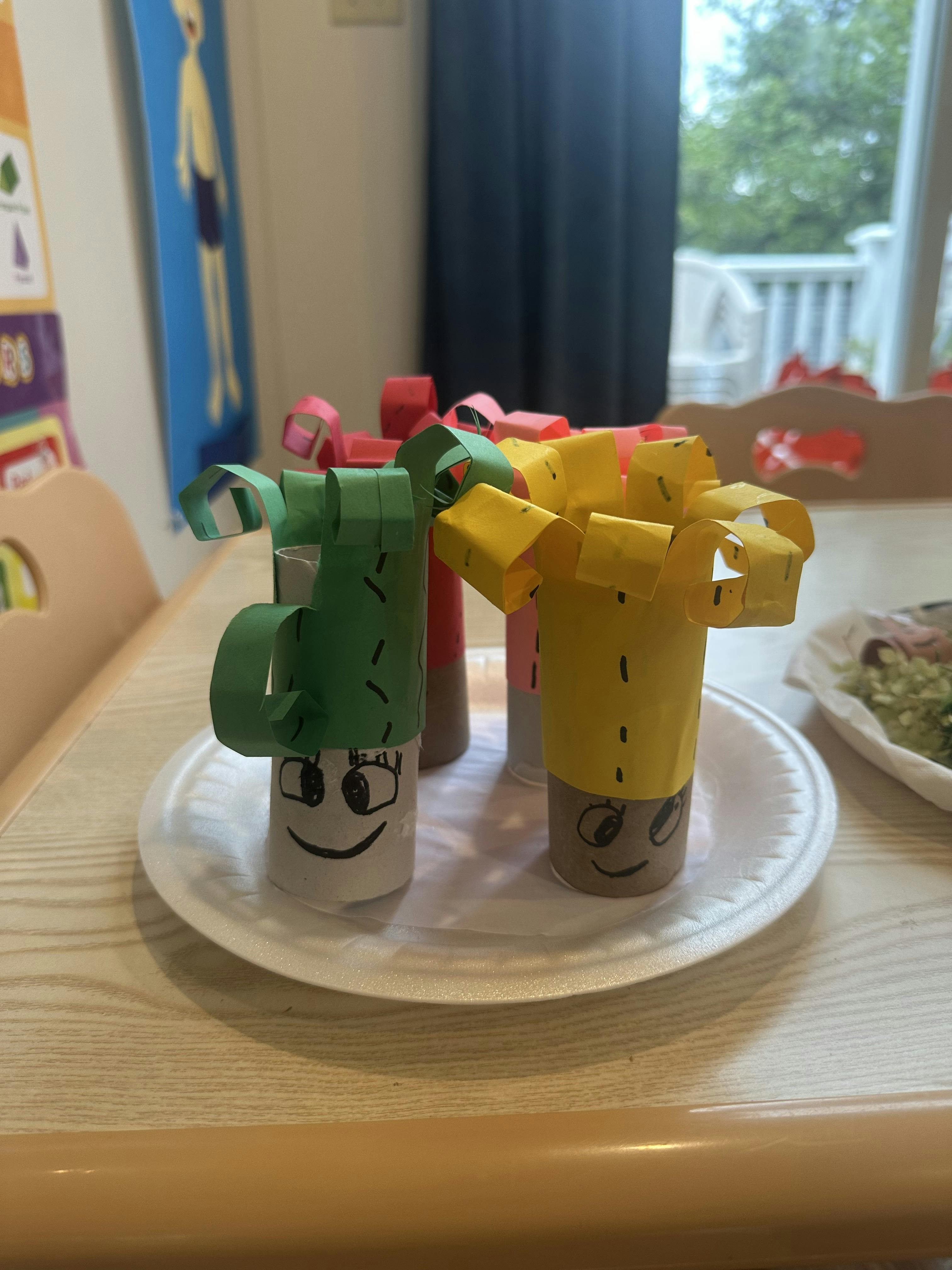 Crafts made from paper rolls with faces and paper decorations