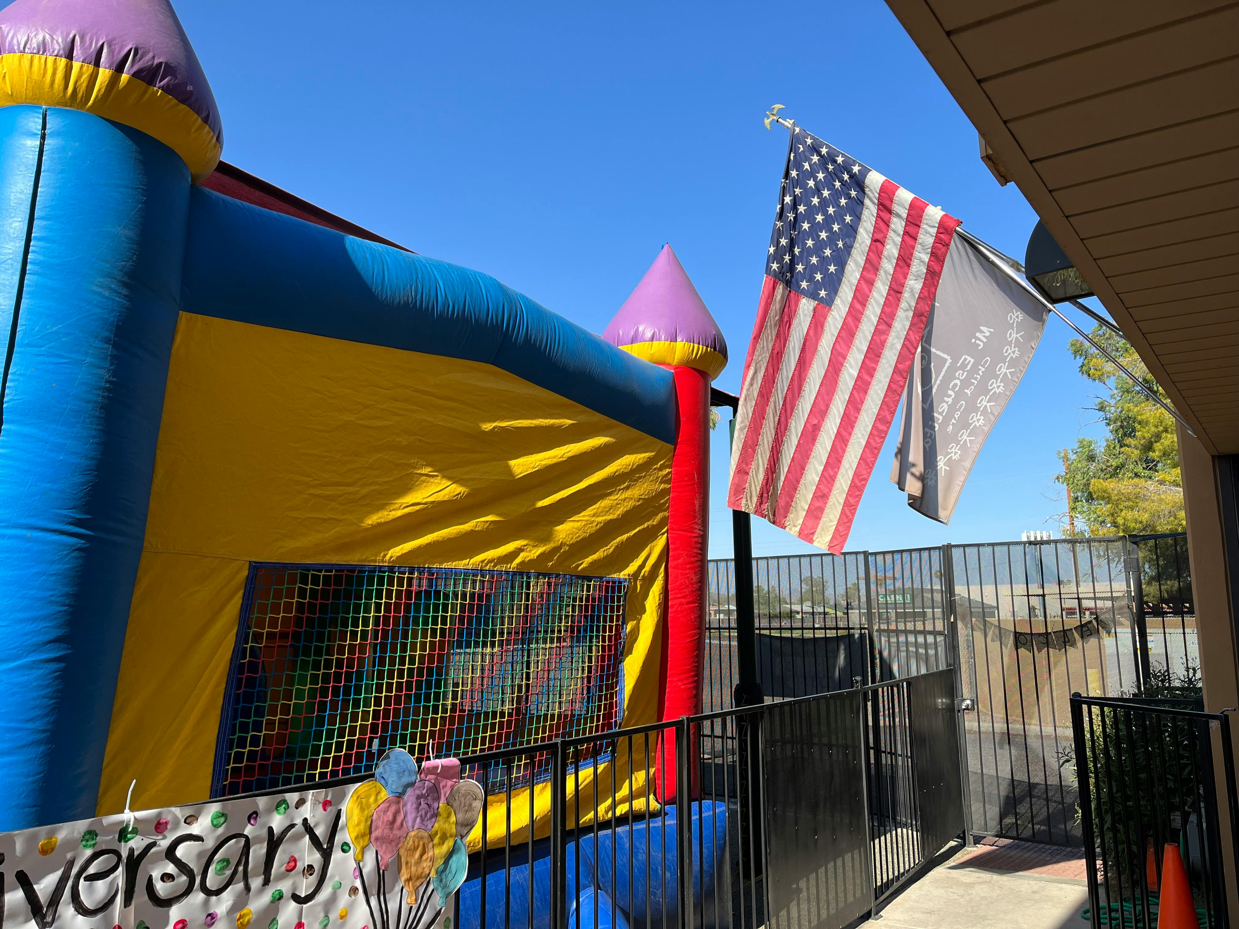 Inflatable bounce house and American flag