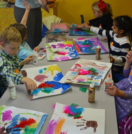 Children doing crafts at a table