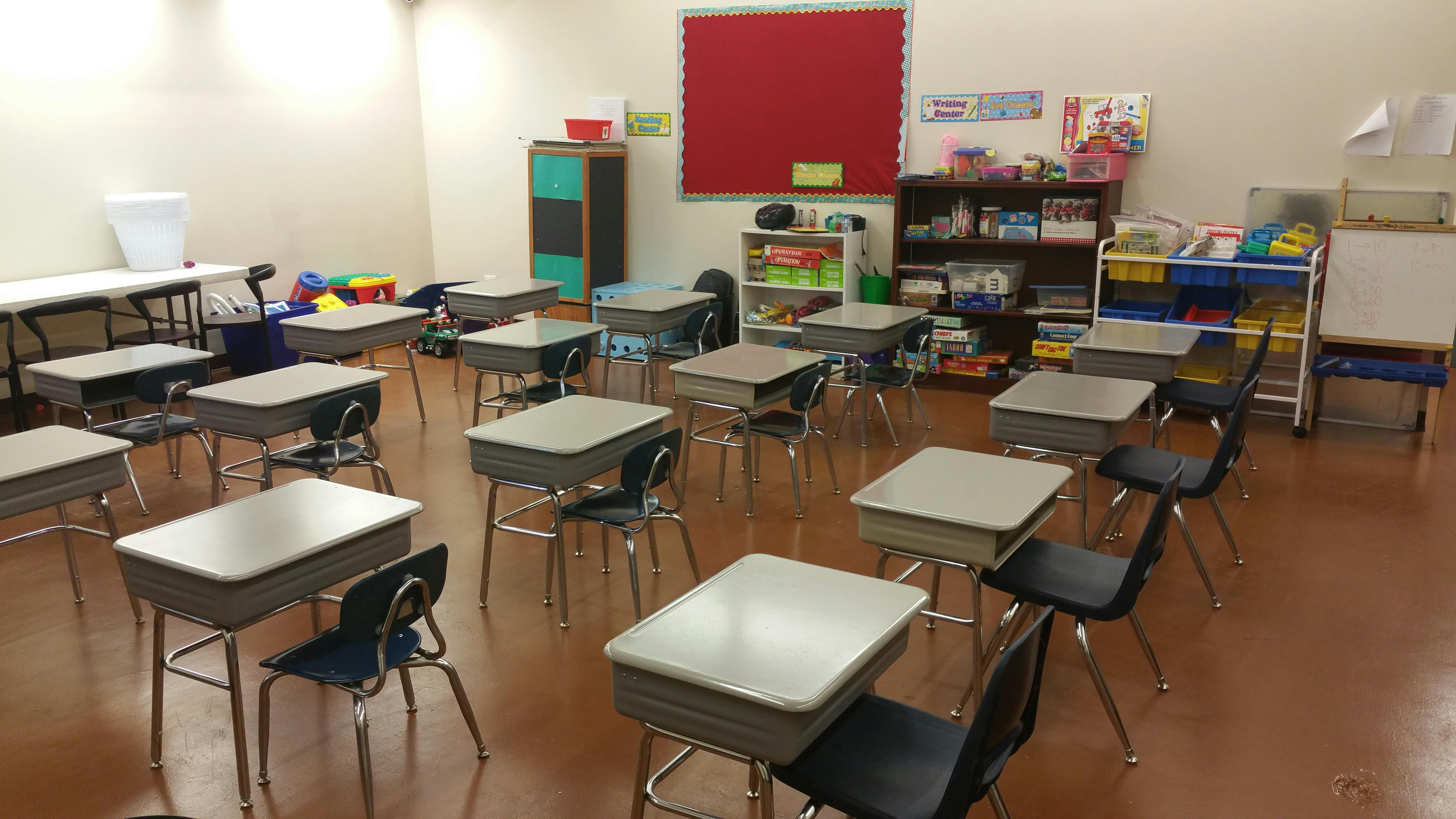 Empty classroom with rows of desks and chairs