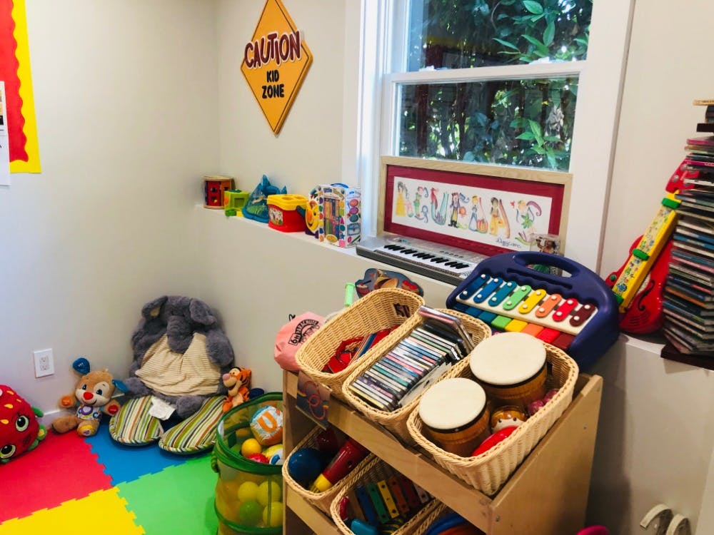 Playroom with toys, musical instruments, and a window