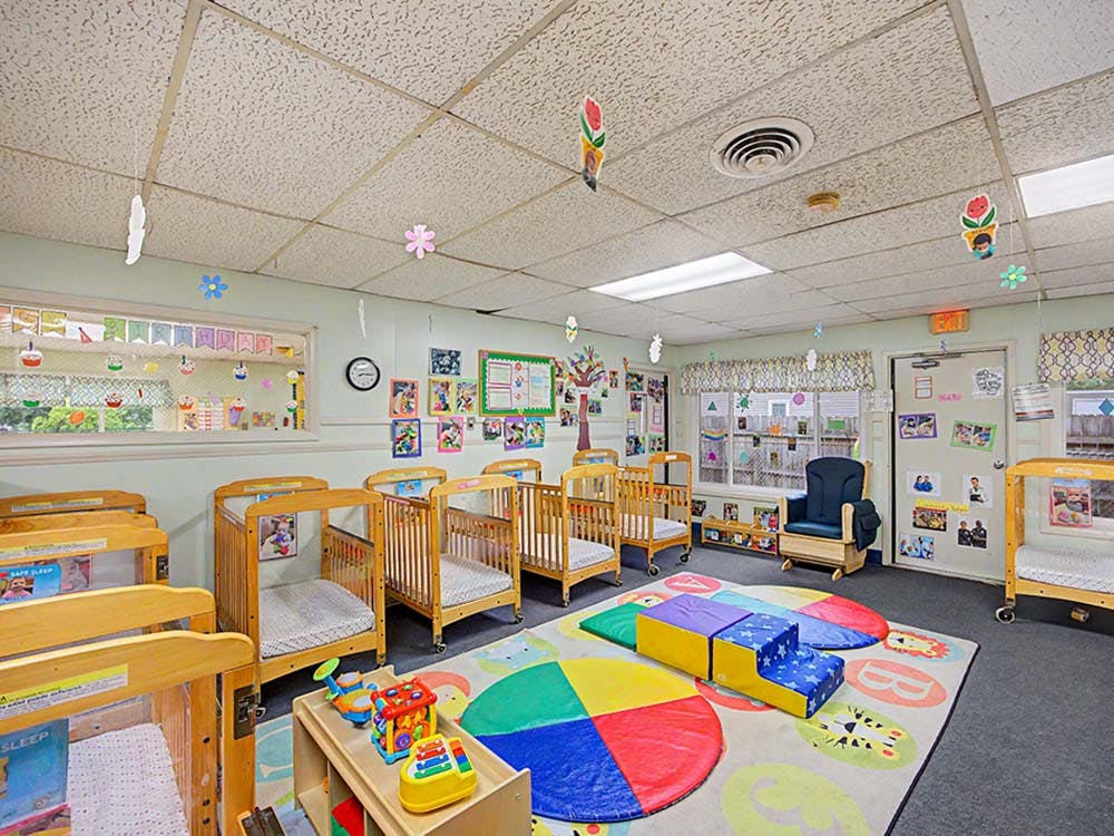 cribs in a daycare classroom