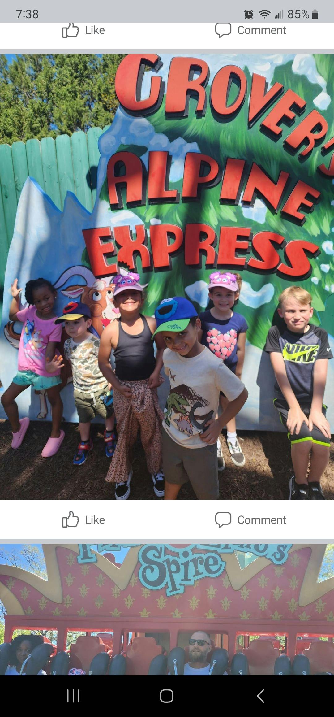 Group of children standing in front of a sign that reads "Grover's Alpine Express"