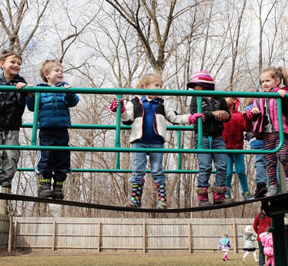 Children on a playground climbing structure