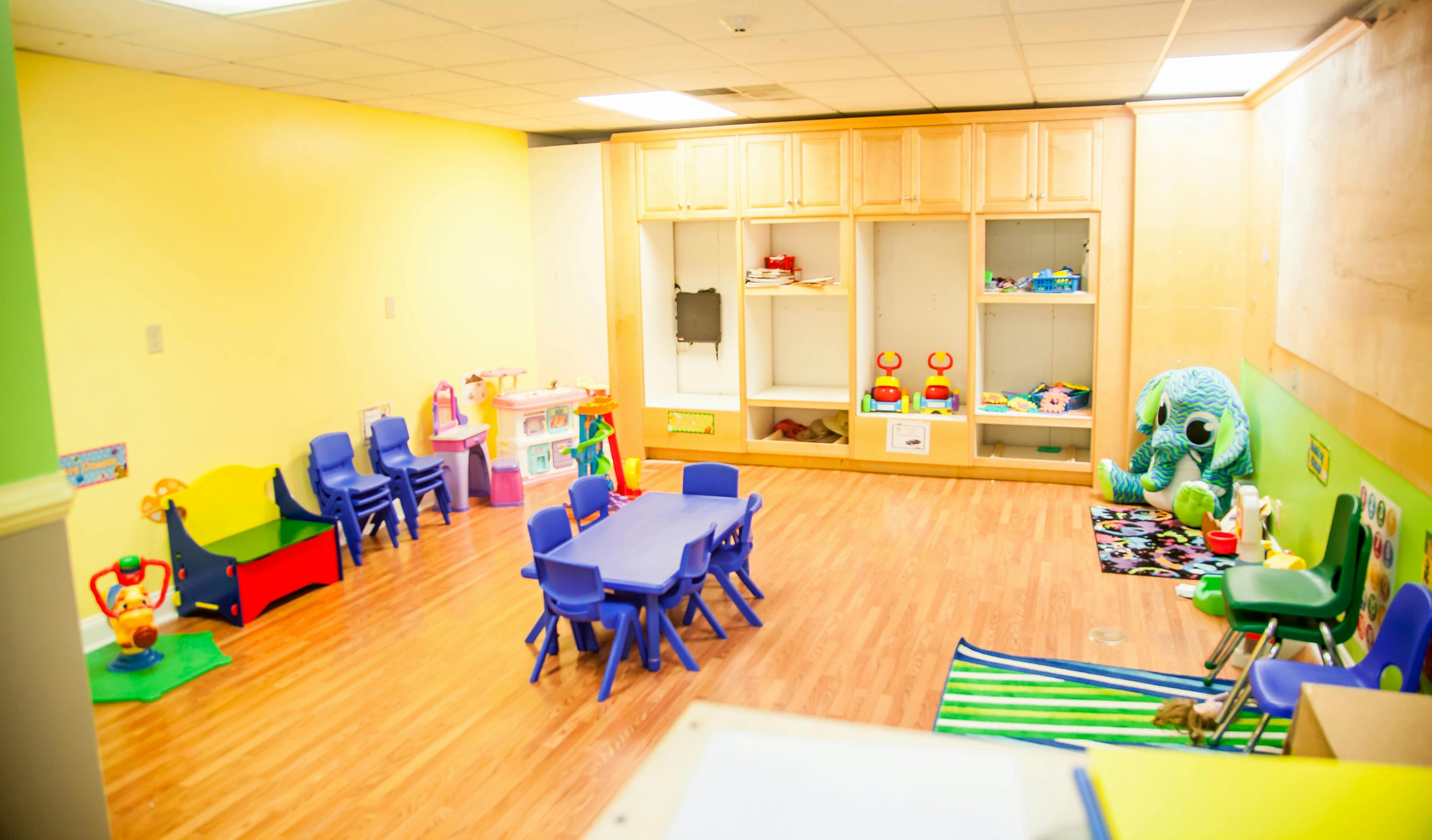 Playroom with small tables and chairs