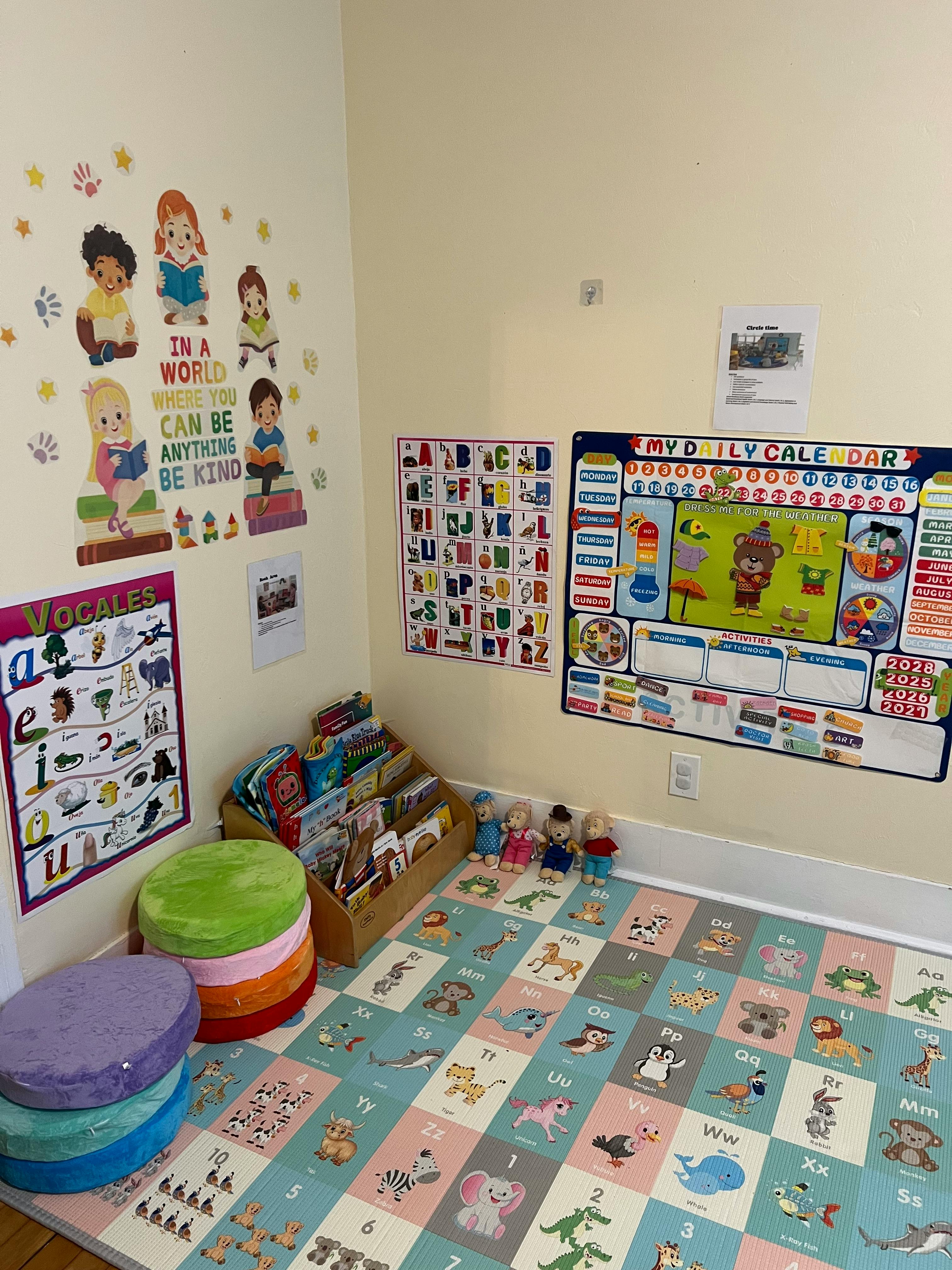 Children's classroom with alphabet posters, calendar, and floor mat