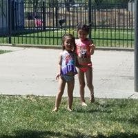 Two children in swimsuits standing on grass