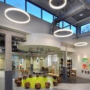 Interior of a modern building with circular lights and large windows