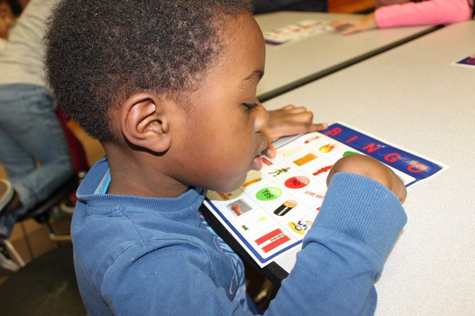 Child looking at a Bingo card