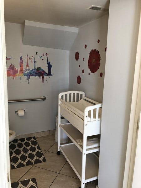 Changing table in a room with wall decals