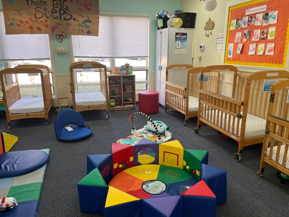 cribs in a daycare room