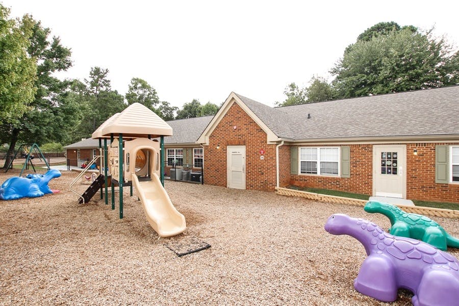Playground with slide and brick building