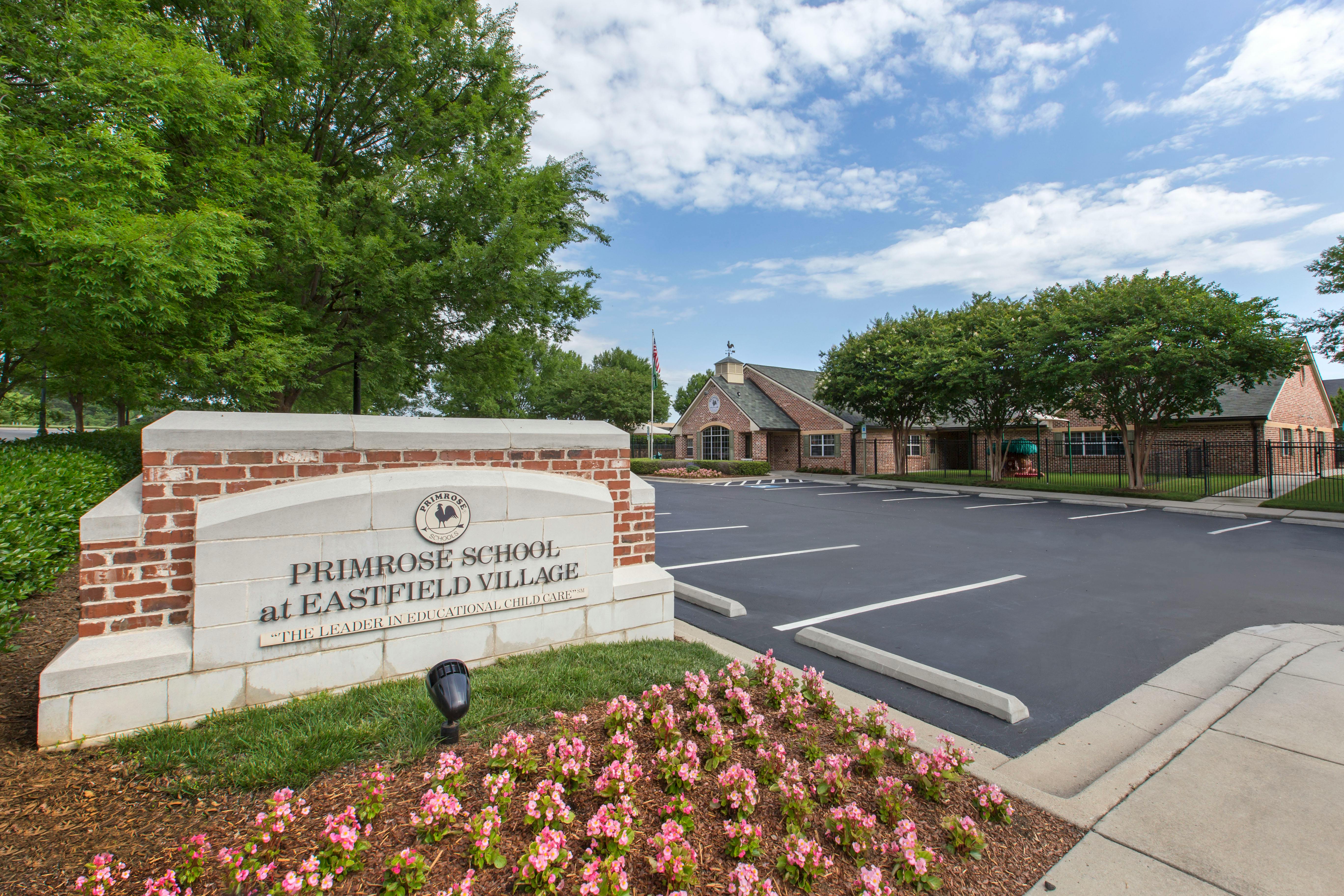 Primrose School at Eastfield Village sign with parking lot and building