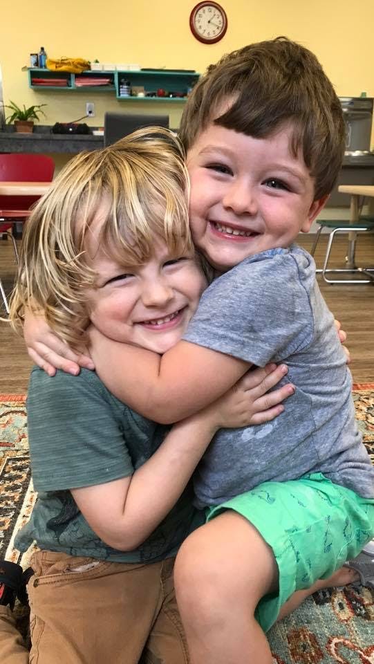 Two children hugging