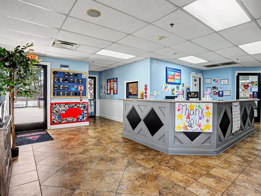 Reception area with a counter displaying a thank you sign