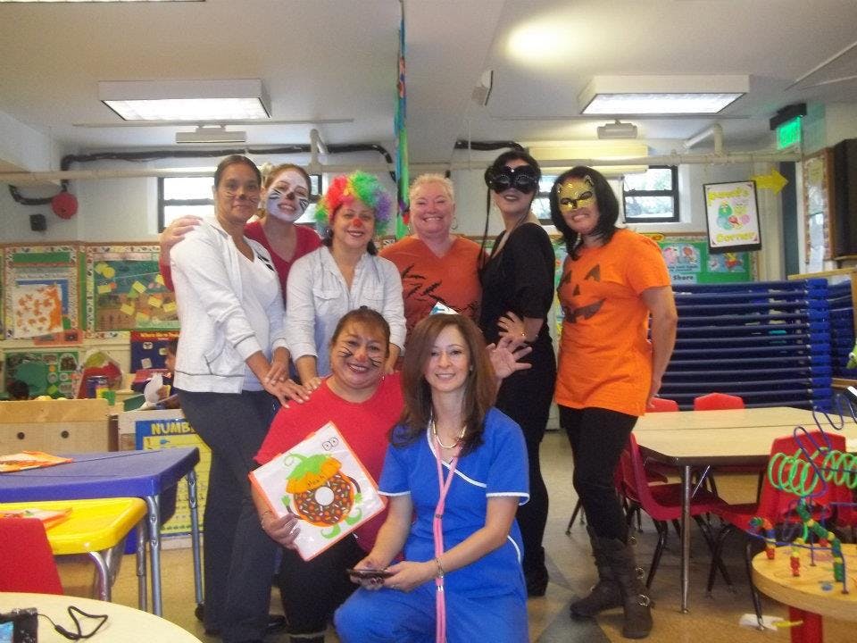 Group of people in costumes in a classroom