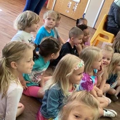 Group of children sitting on the floor