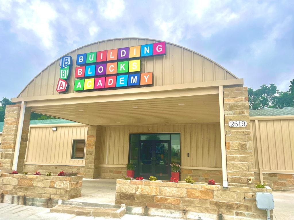Building Block Academy sign on a building entrance