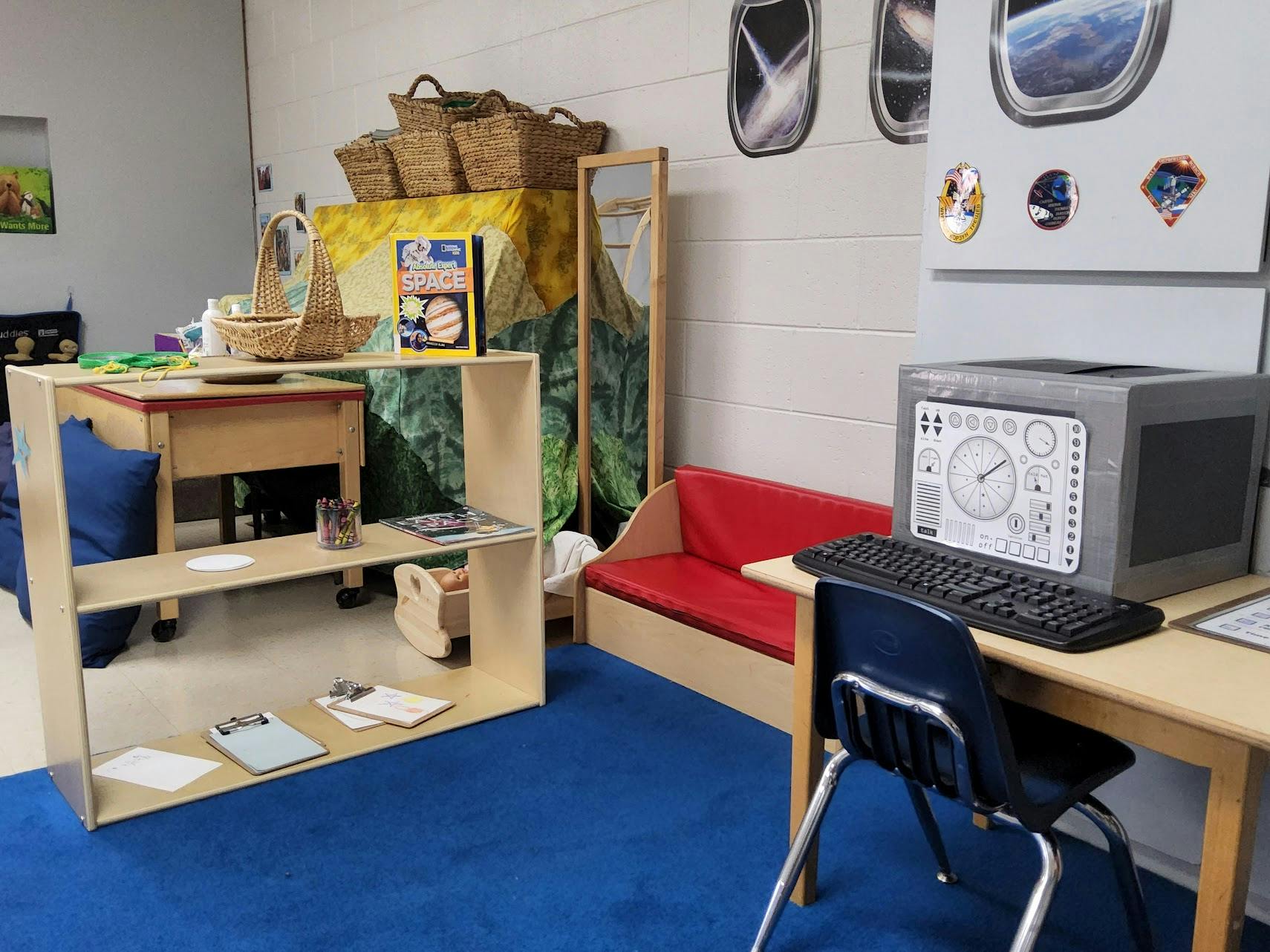 Classroom with a computer station and a bookshelf