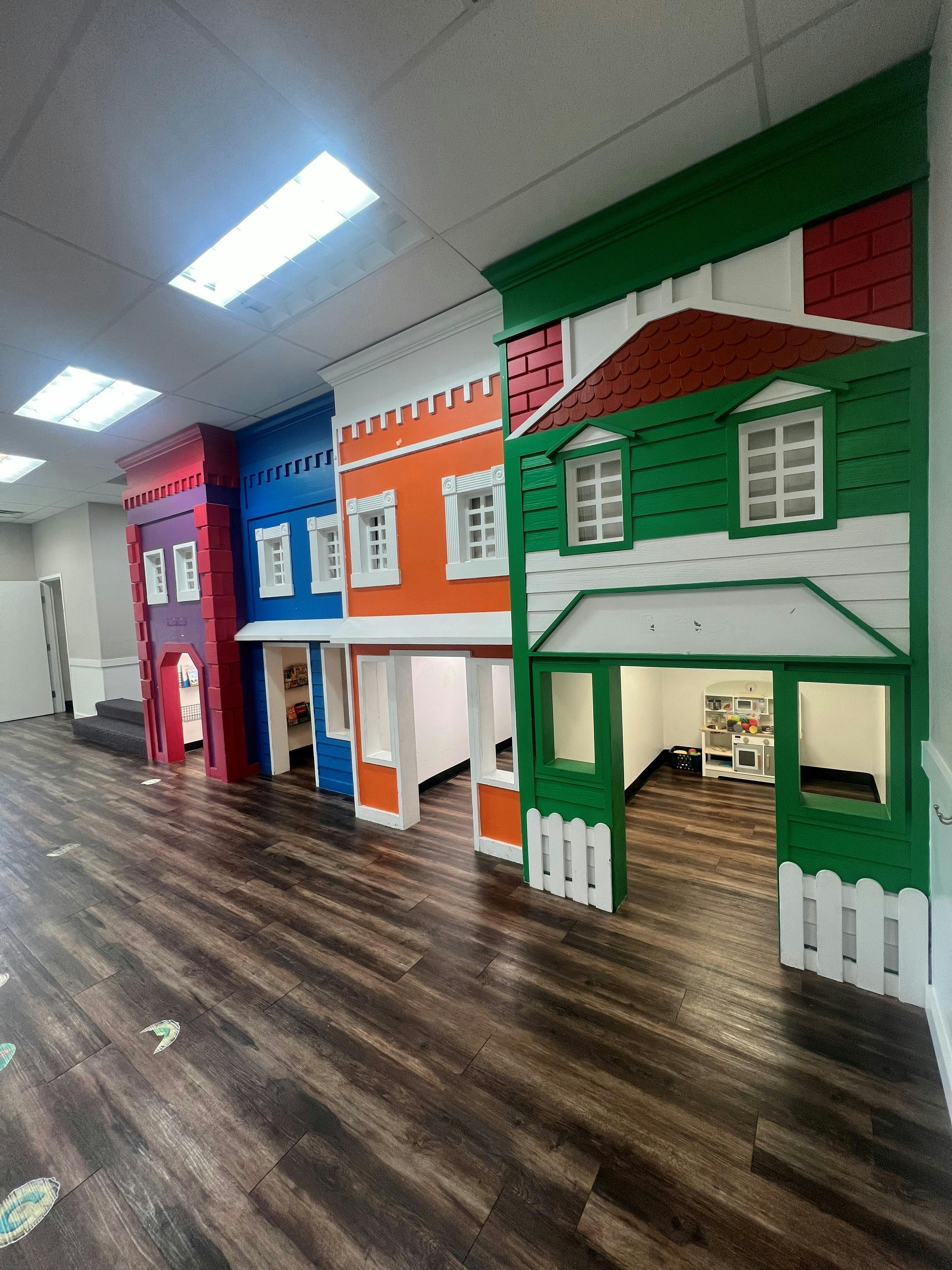 Colorful indoor playhouse facade in a child development center