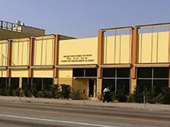 Building with sign that reads "Dalton West Adult Learning and Thompson Policy Study Academy"