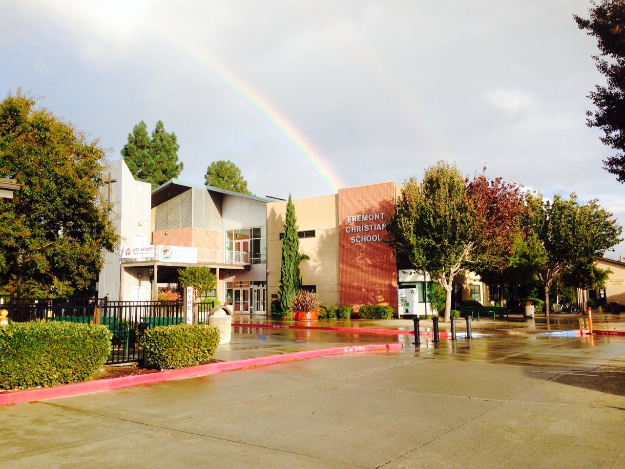 Building with a rainbow in the sky