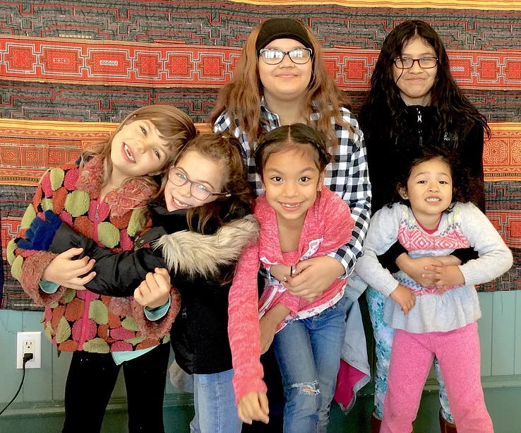 Group of children and teens posing together