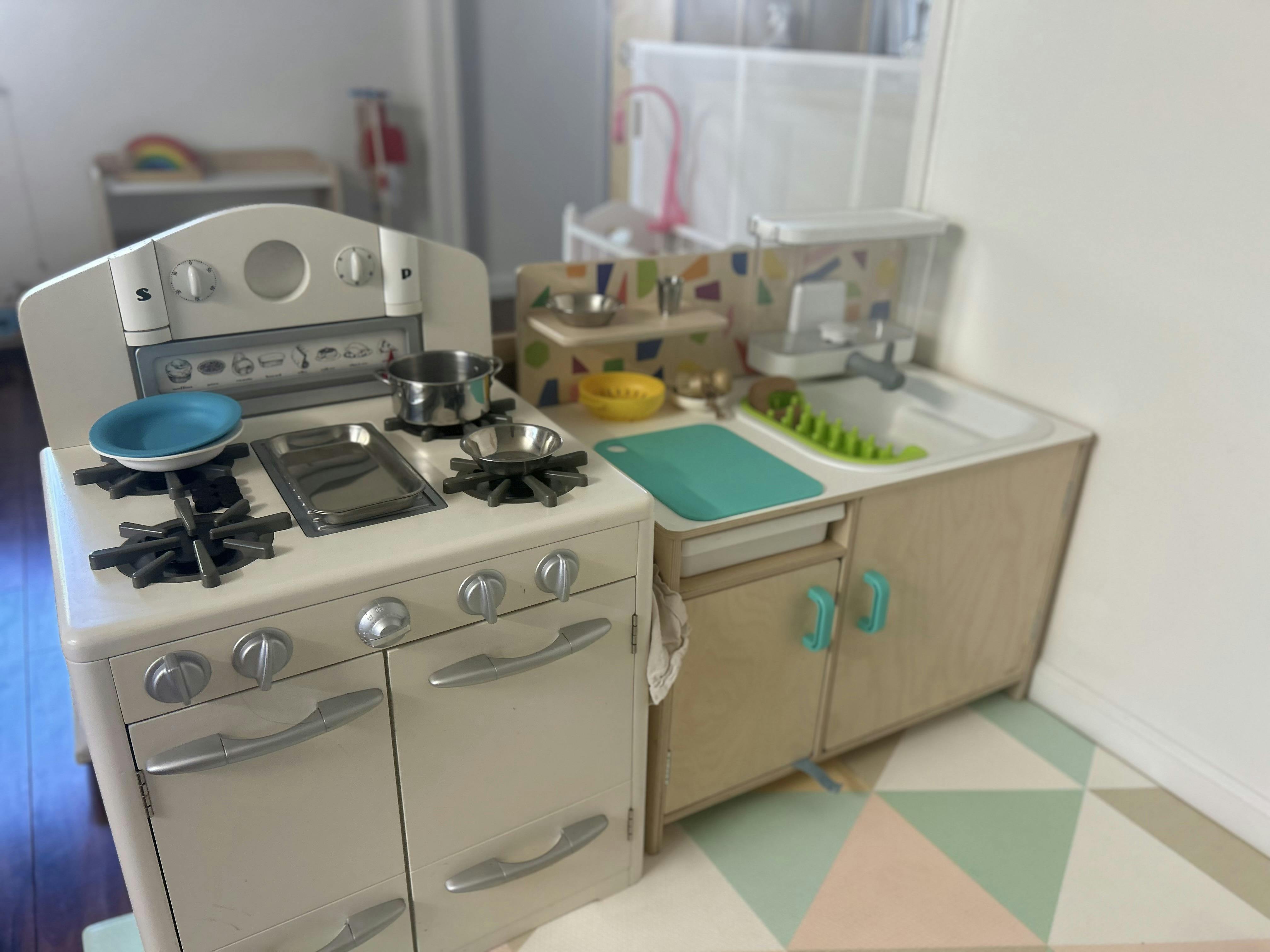 Toy kitchen with a stove and sink