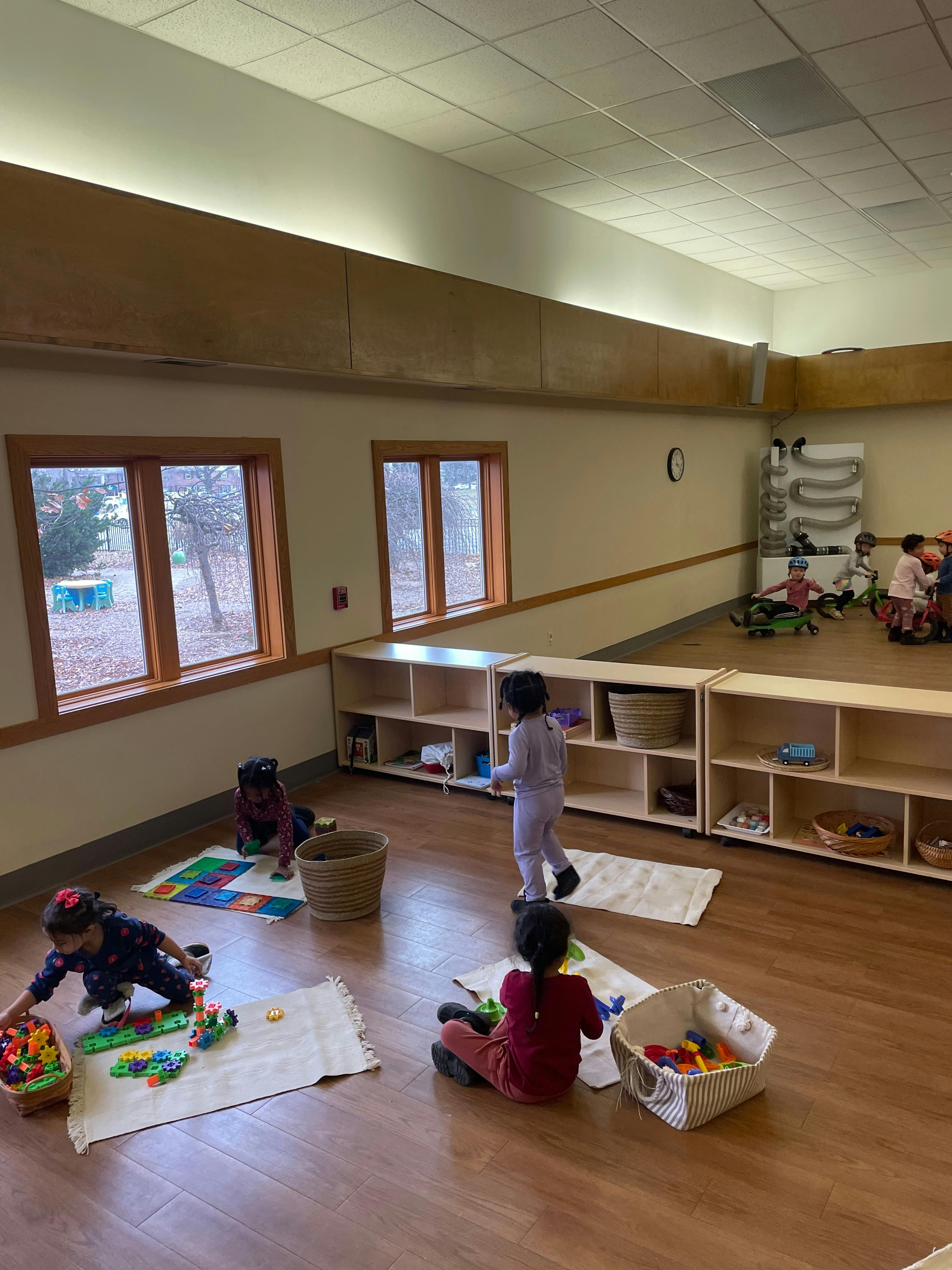 Children playing with toys in a classroom