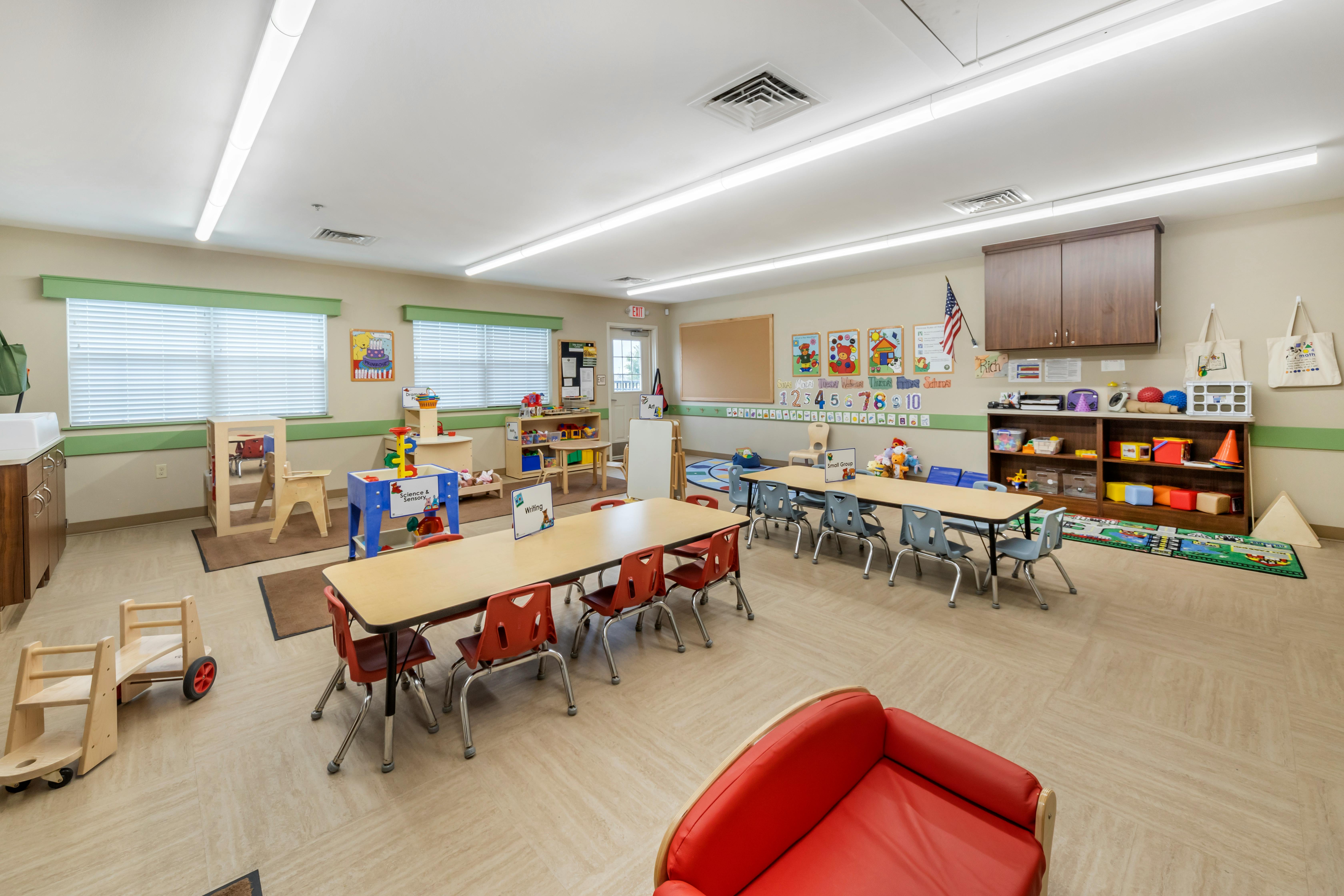 Classroom with tables, chairs, and learning materials