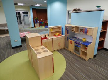 Children's play kitchen set in a room