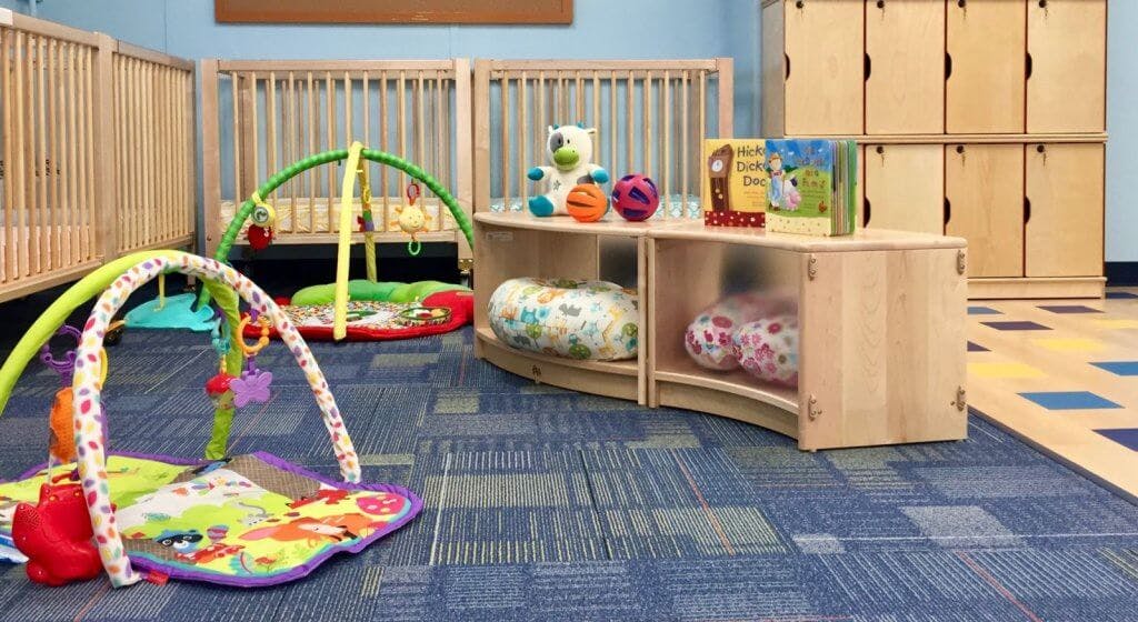 Play mats and cribs in a childcare room